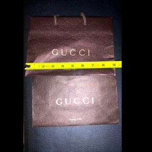 2 small Gucci shopping bags